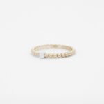 anneau perlé en or rose 18 carats avec une barrette en or blanc