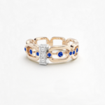 Anneau maillon en or rose 18 carats avec des pierres saphirs bleus, barrette en or blanc avec des diamants