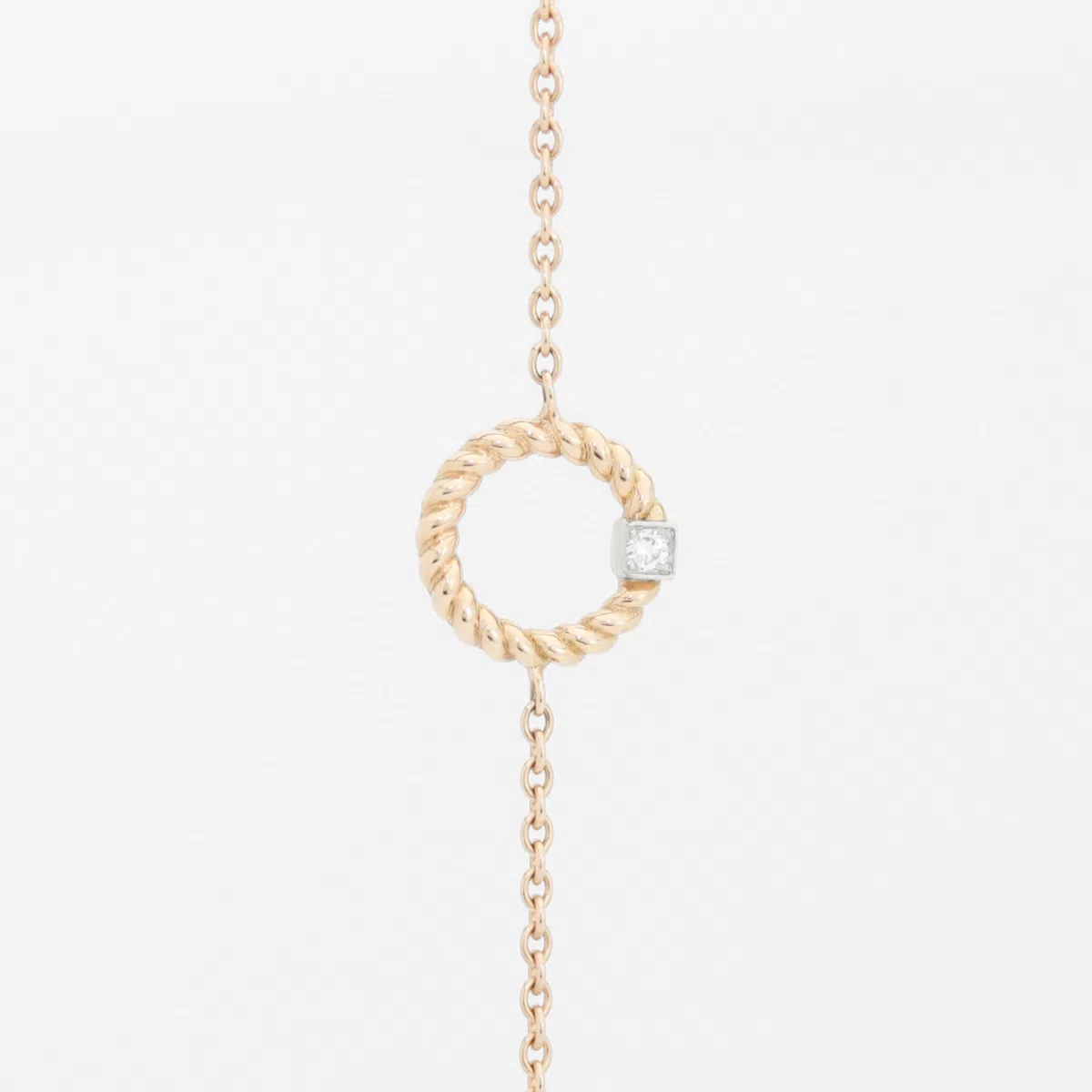 Bracelet en or rose 18 carats en forme d'anneau torsadé et diamant en or blanc