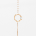 Bracelet en or rose 18 carats en forme d'anneau torsadé et diamant en or blanc