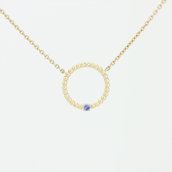Pendentif en or jaune 18 carats en forme d'anneau perlé avec un diamant en or blanc et une pierre saphir bleu